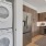 Well-lit kitchen with ample counter space and a laundry space
