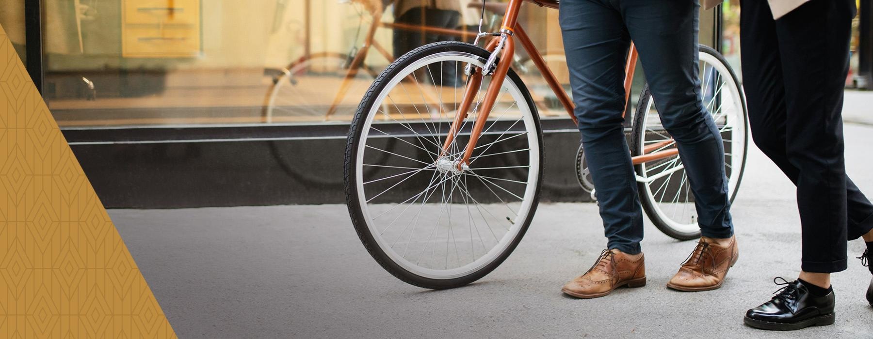 a person holding a bicycle